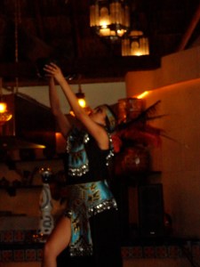 A female dancer salutes the sun in the fire dance